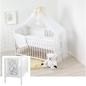 Komplettes Babyausstattung-Set mit weißem Babybett und Bettwäsche mit goldenen Sternen