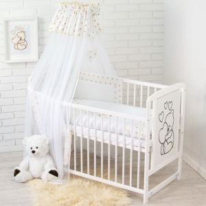 Baldachin mit Schleife und Herzen über dem Babybett