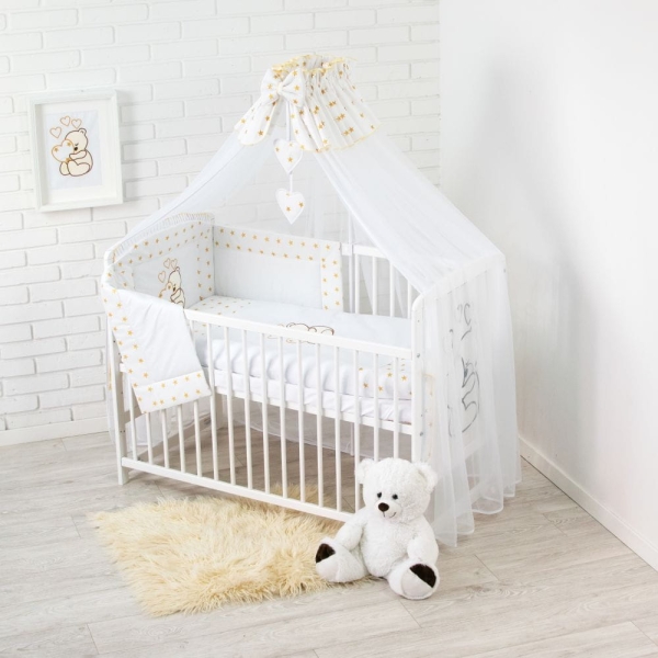 Set: white baby bedding with golden stars + wooden cot 60x120 cm + baby starter kit with accessories